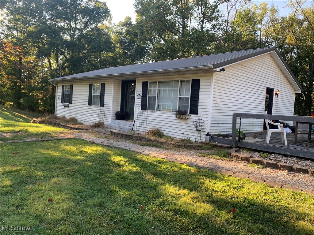 Quiet location minutes from town. Approx 1040 sqft finished in walkout basement. Approx 3/4 acre partially wooded lot featuring shed and 2 car garage. Many possibilities. Sold as is no repairs. Home needs tlc.