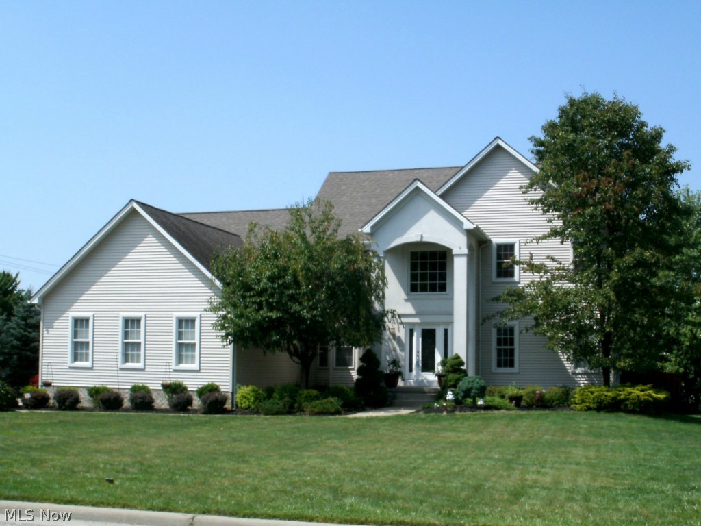 Impressive 4 Bedroom, 2.5 Bath home with quality built with many extras including: 9' ceilings, triple crown molding, marbel gas FP, can lighting, iron staircase, solid 6 panel doors throughout, security system. This First floor laundry, office and a kitchen with large Maple cabinets with all appliances & 2-tier island. Luxurious master bath w/walk-in ceramic shower, Jacuzzi tub & dual closets w/dressing area. With beautiful landscaping with brand new privacy fence and extra large 3-car garage.