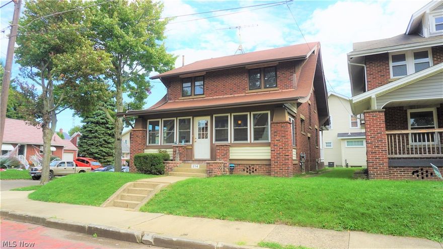 Gorgeous brick home with four bedrooms and two bathrooms. Living room has a brick fireplace and built-in cabinets. Kitchen has hardwood floors and beautiful wood cabinets. One of the bedrooms has a unique walk-out balcony -- a perfect quiet spot to sit and relax. Along with the 4 bedrooms on the second floor, the attic area has potential to be converted into a fifth bedroom. The front porch is completely enclosed with newer windows that are able to open -- it's a beautiful, bright place to relax, rain or shine! Other features include a newer furnace, a waterproof basement, and a low-maintenance yard.