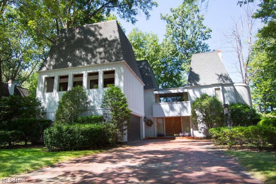 Welcome to one of Bay Village's most spectacular homes, located in Prestigious Huntington Woods Subdivision, just seconds from Lake Erie. This Custom Built 5 Bedroom, 4 Bath home, has incredible solid redwood doors and moldings throughout the home. The home was designed by the Award Winning William Trout. It has also been referred as the "Castle". It features 4 Living Rooms and a Ballroom. One of the living rooms is 43' x 14'. The Beautiful Wooded Homesite has a Large Wood Deck and Concrete Patio at the rear of the home. The home is located 10 minutes from Fine Dining and Shopping at Crocker Park. The Airport and Downtown is less tan 30 minutes away. Beaches, Parks and Pool is less than 5 minutes away. This is a MUST SEE HOME!!!