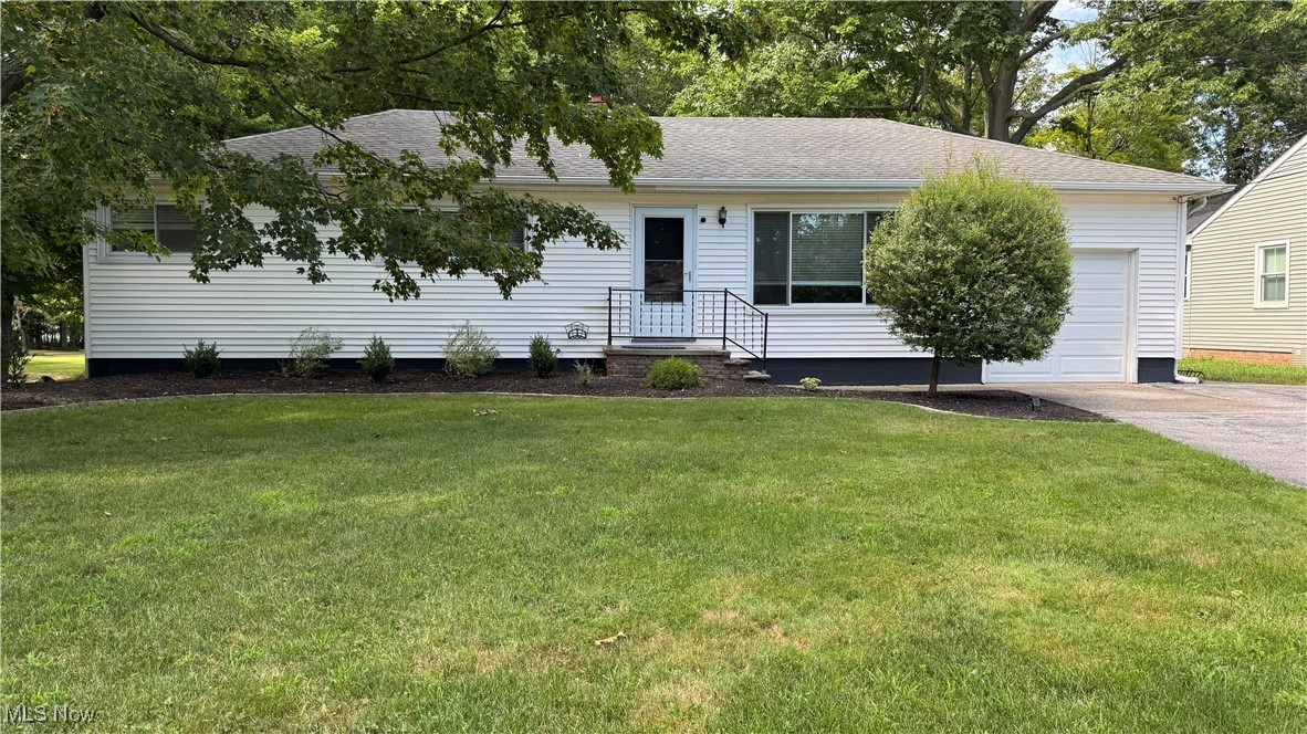 Welcome to this well-maintained ranch located at the entrance of Highland Woods East in desirable Highland Heights. This home offers 3 bedrooms, 2 full baths, and sits on over .73-acres with a private, wooded backyard. Inside, you'll find updated flooring throughout and a functional layout. The kitchen includes wood cabinetry, stainless steel appliances, and a passthrough to the dining area. A spacious family room with a painted brick fireplace provides additional living space, and the screened-in porch overlooks the backyard. Other features include two updated bathrooms, a one-car attached garage with plenty of driveway parking, and a large backyard with a fire pit and storage shed. The owners have completed many upgrades since moving in making it in the condition it is today. Some of the upgrades include: water heater (2024), new flooring and paint throughout (2025), updated laundry room (2025), counter tops and self close cabinets in the kitchen (2025), full guest bath remodel (2023), front steps brick repair (2024), master bedroom floor refinished (2024), and so much more...INCLUDED are all kitchen appliances, washer/dryer, and shed. Conveniently located near I-271, I-90, schools, shopping, restaurants, North Chagrin Reservation, and Downtown Cleveland. Do not miss out on this move-in ready home! Schedule your private tour today!