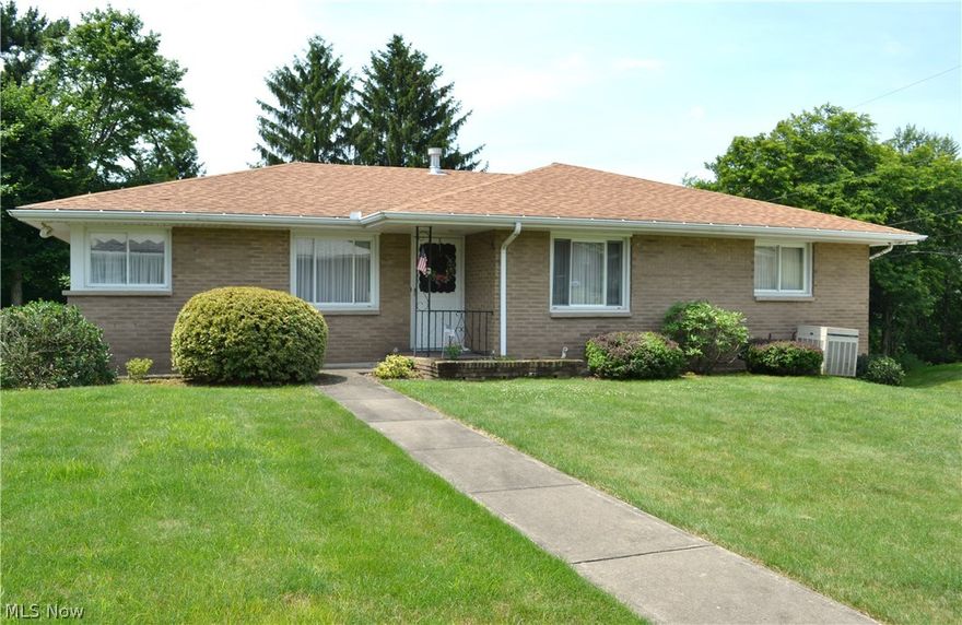 ONE STORY YOU'LL LOVE!  Fantastic offering of this 3 BR, 2.5 bath brick ranch home located on Weirton Heights within minutes to Rt 22.  Spacious rooms include a living room with sliding doors to a covered patio, convenient first floor finished laundry room off an equipped kitchen with dining room.  Huge 13'6x35 recreation room with bath and 2 car garage.  Newer roof and more!