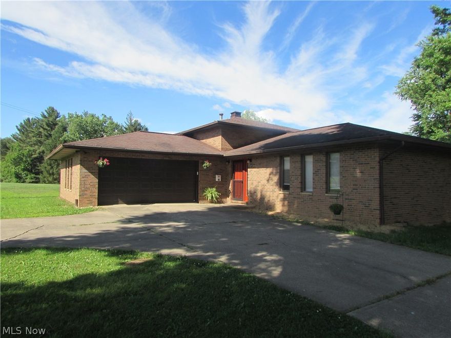 Tri-Level brick home with 3 bedrooms, 2 full and two half baths. Living room, kitchen and separate dining area. Plus large family area in lower portion of the home with fireplace and entrance into the laundry and storage room. There is also entrance from the 24 x 24 attached garage into a mud room access to a 1/2 bath. The covered 12 x 20 back porch offers a shaded area on the hot summer days with trees as well. There is also a smaller 14 x 24 garage plus a 11 x 26 tool building for storing mowers or ATV's. Offering almost .91 acre lot. Close to North Bend Golf Course and North Fork Hughes Rive Lake and dam