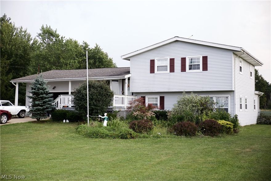 Welcome home to this spacious, five bedroom, split level home with walk-out basement.  This beautiful home is situated on a half-acre with a gorgeous back and side yard views.  Enjoy the usage of the large two-story shed in the completely fenced in backyard. Move right in and make yourself at home in this lovely house that offers sizable bedrooms and roomy living space. Pergo flooring and built-in desk will make this family room your favorite place in the house.  The living room offers a beautiful bay window with views of the fields across the street.  Garage access from kitchen and basement and lower level exits to backyard.  New furnace and air conditioning units in 2012, Rural Lorain County Water installed new pipe in 2011, newer roof.  If you need space, this is the place!  Schedule today to see this spacious house and large yard with amazing country views.  Close to Keystone schools, Grey Hawk Golf Club and all the amenities the quaint town of Lagrange has to offer.
