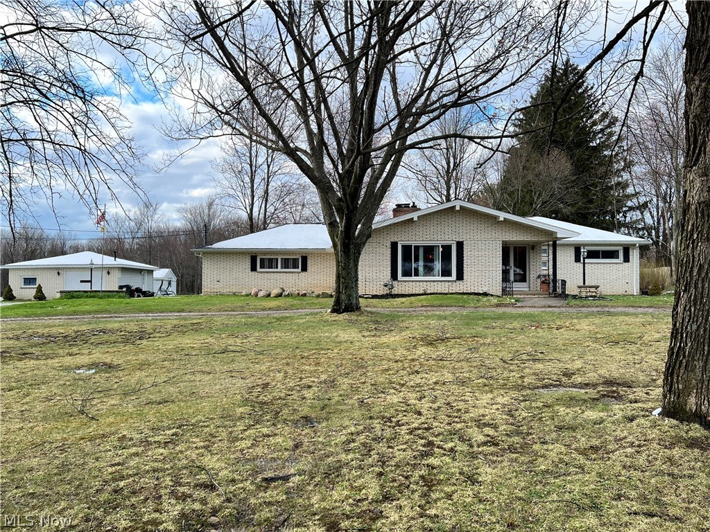 Beautiful brick front & vinyl sided Ranch with full basement! 1 full bath & 2 half baths, 2 stone fireplaces. Perfect location with 3.21 acres to enjoy, an open field with a park-like setting with man made trails! Circular front driveway can accommodate numerous cars. Oversized 2 car side load garage with hot & cold water and floor drain, cedar closet, built-in cabinets & pulldown stairs for access to attic space above the garage. There’s also a 1 car detached garage w/workshop, plus a large vinyl sided storage shed. The basement was waterproofed in 2017 by the previous owner. Enjoy those picturesque views as you relax in the comfort of your rear LR w/huge picture window! Newer Roof in 2019. The possibilities are endless to make this home your own to enjoy! HVAC, hot water tank, air conditioning unit and most windows are newer. Don't wait - Call Today to schedule a private showing!