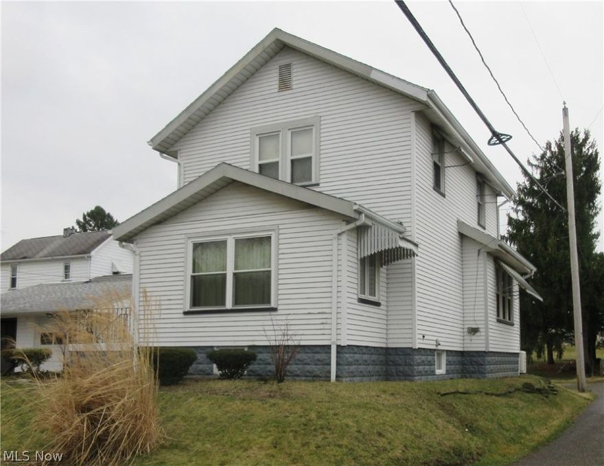 2 bedroom, 2 story home. Natural woodwork through out the whole home. Vinyl replacement windows. In home security system and full house generator. Newer roof and furnace. The 2 car garage is shared with the neighbor with a party wall separating the two spaces. Washer, dryer, range, refrigerator, and dishwasher all stay.