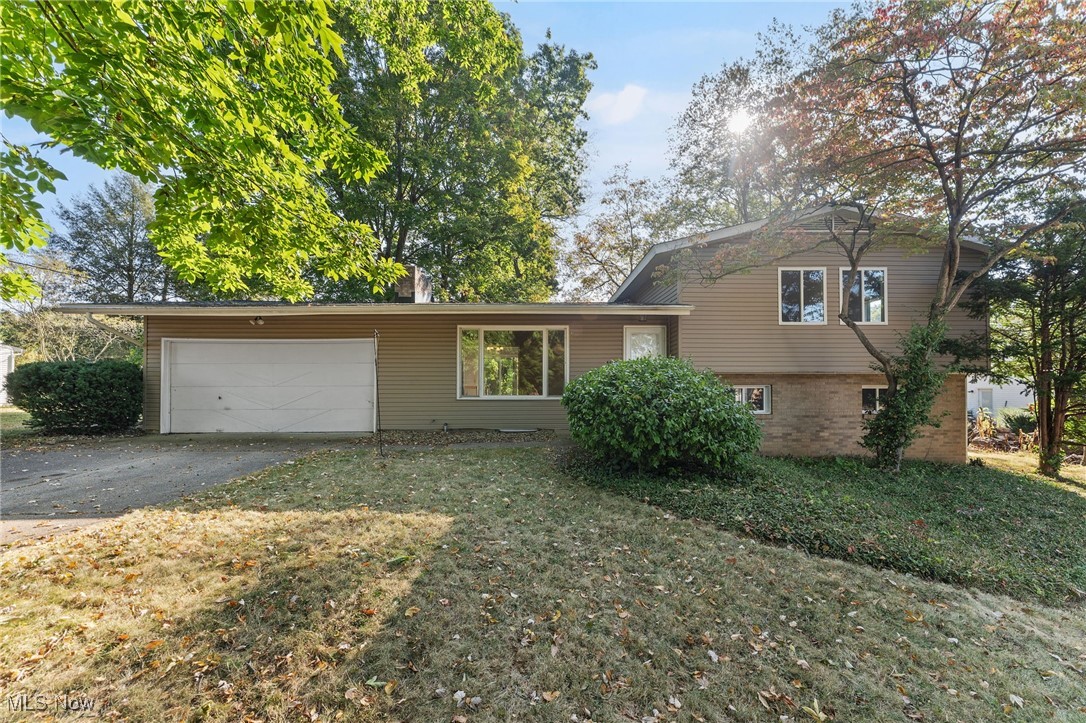 Welcome home to 487 Beaumont Dr., an exceptionally well-loved split-level home, situated on a 1/3-acre lot in the peaceful, ideally located neighborhood of Fairlawn Heights Estates. Upon entering the home, you're welcomed by an abundance of natural light filling the expansive, vaulted living room with hardwood floors, large picture window, wooden beams, and wood-burning fireplace with stone hearth. The living room opens into the tremendous eat-in-kitchen with fantastic views of the backyard. The kitchen is complete with stone countertops, soft-close cabinetry, tile backsplash, and stainless steel appliances, and the dining area has direct access to the backyard through the large sliding glass door and to the oversized two-car attached garage, which also has direct access to the backyard. Three sizeable bedrooms, each with beautiful hardwood floors, and a full bathroom with tiled shower-tub combo are on the upper level; the largest bedroom has direct access to the full bathroom. On the walkout lower level, there is a massive rec room with natural light, a closet for storage, recessed lighting, direct access to the backyard, and a full bathroom with a fully tiled shower. Finishing the interior of the home is the basement, which houses a room with a closet, previously used for a fourth bedroom or office, and a large unfinished space for laundry and storage. The serene, treed backyard has a deck, paved patio, fire pit, and playset and is pesticide-free, providing a space for all people, pets, and nature to enjoy freely without worry. This home is in a prime location, being just around the corner from Fort
Island/Griffiths Park, which has tennis courts, basketball courts, a playground, and trails, Fort Island Swim Club, and Fort Island Primary School. It is also mere minutes from several amenities, including restaurants, shopping, entertainment, several other parks, and quick access to highways. Call for a list of updates and to schedule a showing today!