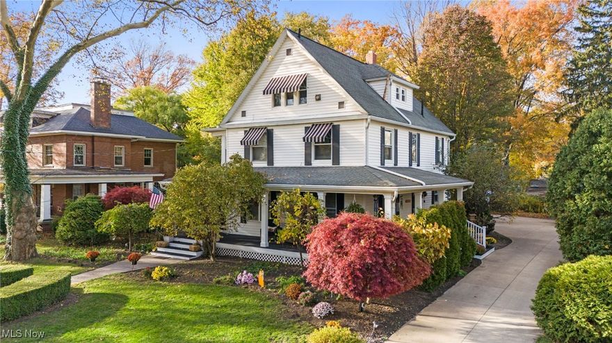 Welcome to this beautifully maintained historic gem, offering timeless character, modern comfort, and stunning curb appeal. Nestled among mature trees and vibrant landscaping, this timeless home features a charming wrap-around porch, gabled rooflines, and inviting striped awnings that create a warm, welcoming presence from the moment you arrive.
Step inside to discover bright, spacious rooms filled with natural light. The large living room boasts hardwood floors, roman columns, plantation shutters, and an elegant fireplace—perfect for cozy evenings and gathering with family and friends. Adjacent trim and detailed millwork highlight the home’s original craftsmanship.
The updated kitchen blends modern convenience with period charm, featuring white cabinetry, granite countertops, stainless steel appliances, and a unique built-in pantry hutch. A center island adds workspace and functionality, making this kitchen ideal for everyday living or entertaining.
A light-filled sunroom with panoramic windows offers the perfect spot for morning coffee, an art studio, or a peaceful reading nook. The home’s thoughtful layout continues upstairs with generously sized bedrooms, including a spacious walk-in dressing room in the primary suite, equipped with extensive custom closet organization.
The possibility for outdoor living shines here with multiple serene spaces to enjoy. A beautifully designed hardscape patio with pergola is perfect for dining al fresco, while the circular stone area provides the perfect place to gather around an outdoor fire pit. The invisible fence, is perfect for no-fence pet living. The well-kept hot tub is ready for entertaining, having just been serviced and new filters installed.  Leaf guards have just been installed and help lower maintenance costs. 
From its architectural charm to its modern updates and inviting outdoor spaces, this home offers a rare blend of elegance, comfort, and history.