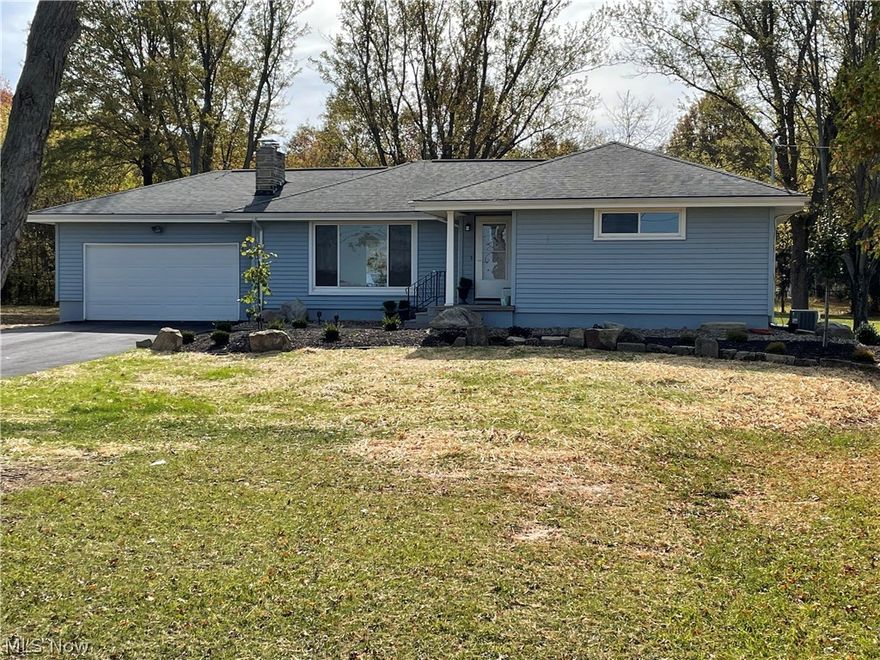 This house resting on a 1.72 acre parcel has had many improvements in recent years including a new septic system, a brand new boiler for the hot water heating system, new glass block windows, a new full bath in the basement, and a large deck on the rear of the house with maintenance free trex board floor.  The house has wood flooring through out that has been recently been restrained and sealed.  It also has a freshly paved driveway and attached two car garage.  The kitchen has granite counter tops and the large living room has a wood burning fireplace with an air tight super efficient stove to reduce heating costs.  If owner chooses not to heat with the stove, a new propane tank has been installed and filled with over 250 gallons of lp.  The house has been recently painted and is move in ready.  There is a large storage barn as well as a smaller metal shed on the the property.  The landscaping is fresh and along with the lot is clean and easy to maintain.  There is an additional 1.25