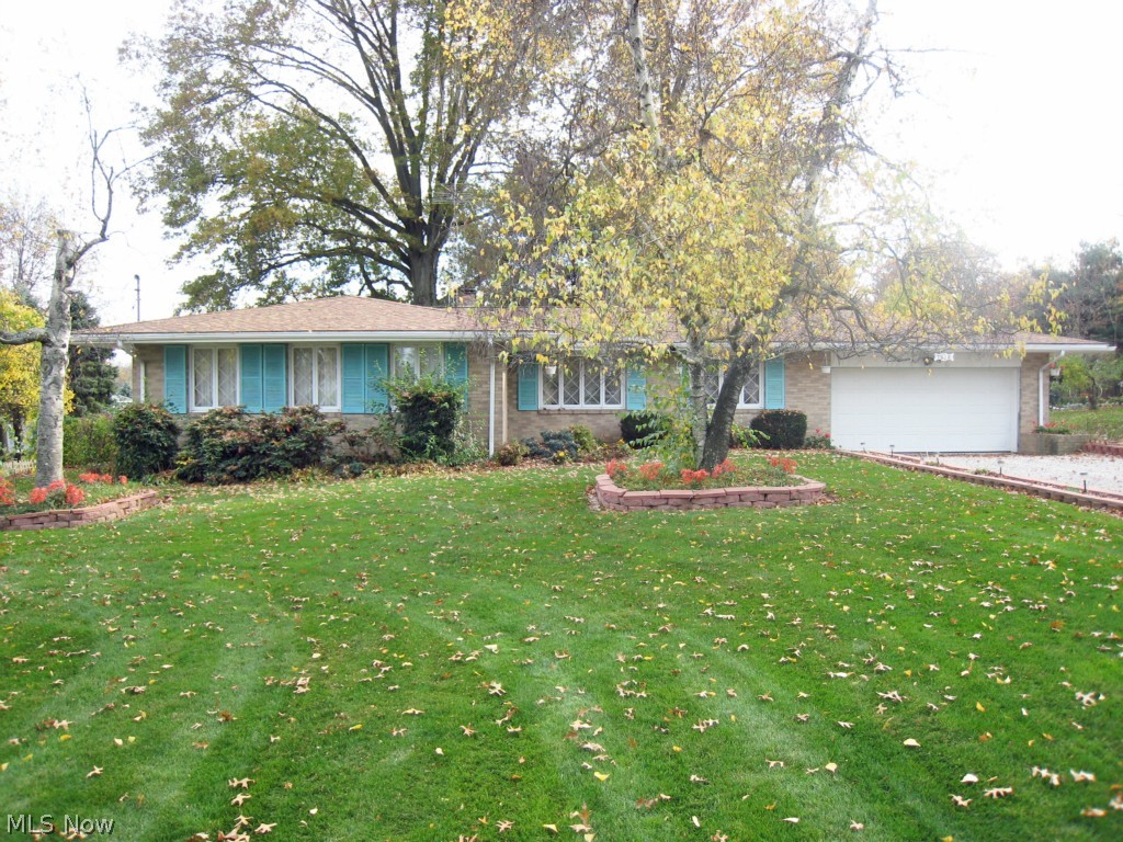If you're looking for a spacious brick ranch on a great lot, consider your search over! This 3 bedroom, 2.5 bathroom home sits on a 105'x200' corner lot. Hardwood floors throughout. Open the front door and step into the large living room which is open to the dining room. Kitchen has a breakfast bar and is open to the family room. Family room features a wood burning fireplace and a sliding glass door to the patio. Backyard is large and has a private park-like feel. Master bedroom includes full master bath. Basement is large, open and ready to be finished. Recent updates include new high-efficient furnace(2008), new roof(2009),new well pressure tank(2005), and newer water heater. Ranch homes are in high demand so schedule your showing before it's sold!