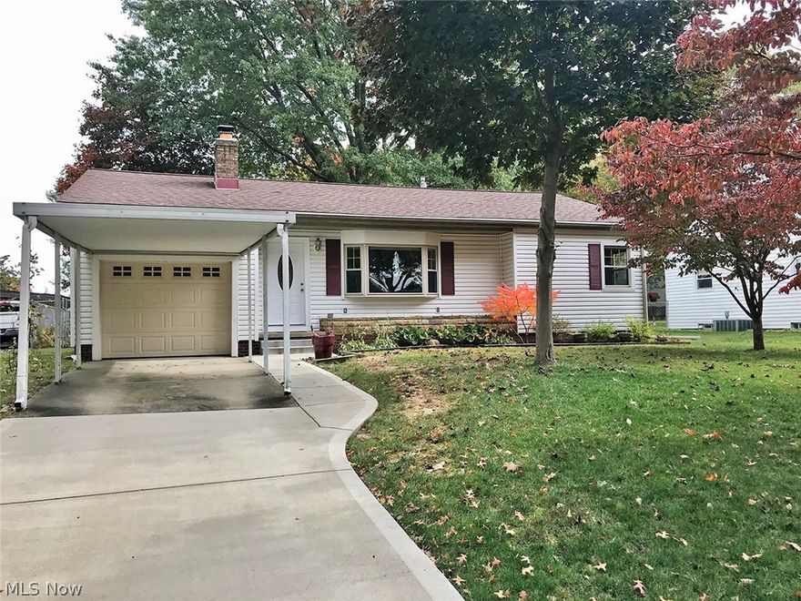 Darling updated ranch in move-in condition! Open floor plan featuring remodeled kitchen, bath, and vinyl plank floors. Great fenced in yard with large covered deck and stamped cement patio with fire pit and swing. Attached garage plus carport. Additional square foot in 3 seasons sun porch and rec room.