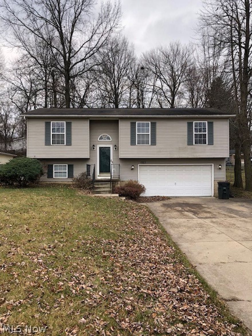 Updated Bi-Level on nice size lot.  Living room with cathedral ceiling.  Open kitchen with island.  Kitchen appliances stay.  Eating area with sliding glass door to deck that overlooks the fenced backyard.  Primary bedroom with vaulted ceiling.  Bathroom  with skylight.  Lower level with family room and half bath.  Attached 2 car heated garage.