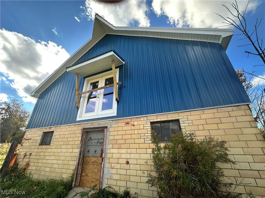 Incredible Investment Opportunity! Situated on a spacious 2.47-acre corner lot, this property is full of possibilities. The centerpiece is a well-maintained, structurally reinforced barn with excellent potential to be transformed into a stunning barndominium. ..Barn Office equipped with heating, air conditioning, washer and dryer, a new hot water tank, upgraded water system, and a cozy loft bed, the barn's existing living quarters let you move right in while you develop the rest of the property. A spacious barn loft awaits your creative vision, and the main level is ideal for a workshop, storage or animals.  The original 1709 square foot home on the property is currently uninhabitable due to fire damage, but the rear portion may be salvageable for a rehab project—or you can clear the space entirely and build new, even build up for more space!. The property includes a functioning well, septic system, and updated electrical servicing both the house and barn. Bonus: There’s potential to extend the driveway for access from both Madison Road and Joanne Drive, offering even more flexibility for future development. Don’t miss your chance to explore and shape this one-of-a-kind property—schedule your showing today!