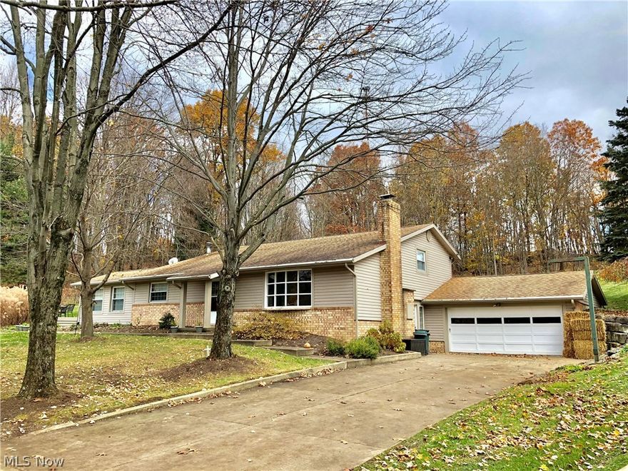 Weekends await at the beach near this 3 bedroom, 1.5 bath home in the private, gated community of Lake Mohawk.  You'll enjoy a casual family room, classic living room with wood-burning fireplace and beautiful laminate floors, convenient laundry, eat-in kitchen with appliances included, bonus room could be used as a 4th bedroom or office, over sized garage.  Some of the updates of this beautiful home include a hot water tank (2015), laminate flooring and stair rails (2012) and a roof and windows (2005).  This unlimited horse power lake community offers access to a Par 3 golf course, great fishing, lighted tennis courts, play grounds, a basketball court and numerous clubs.