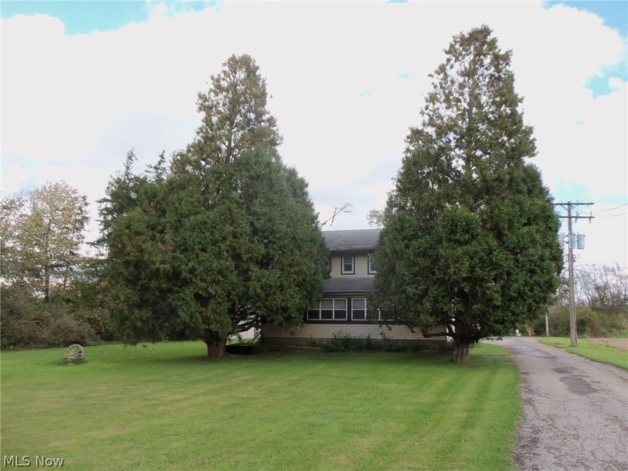 Great Opportunity to own a 10 Acre parcel in Middlefield Twp.  4Br, 1 bath Colonial with detached 20x24 Garage with 12 ft overhang and 54x38 building plus a 32x60 addition. Concrete floors, 3 phase electric power, Commercial heating and air conditioning with Natural gas available. Selling AS IS, WHERE IS...Priced well below  Appraisedl Value.