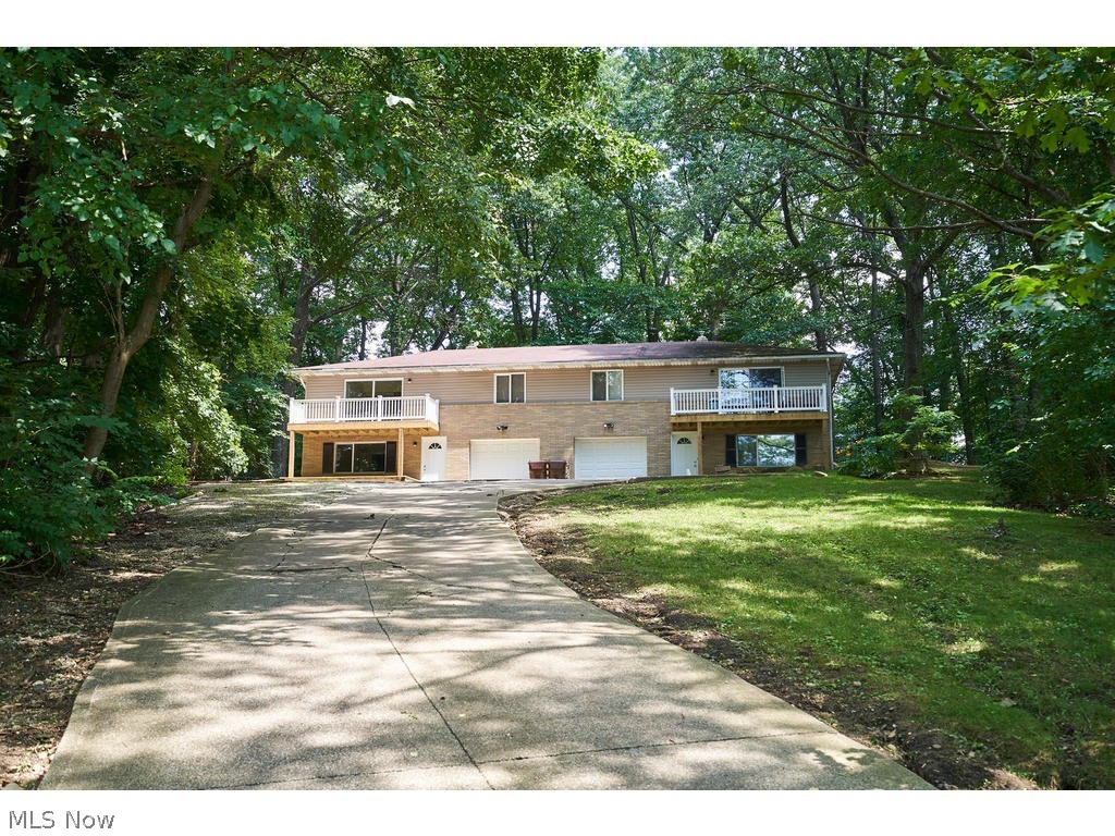 Updated Portage Lakes are twinplex with attached garages on a private lot. Each unit has 2 beds and 1.5 baths and have been rented for $765-$800 per month. Back yard with patio and privacy vent backs up to a peaceful wooded lot.