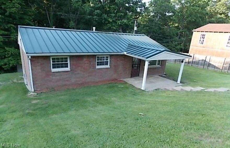 BRICK RANCH 3 BEDROOM HOME WITH 2 FULL BATHS.FRONT PORCH,SIDE DECK.1 CAR REAR ATTACHED GARAGE.REAR SHED.RECROOM,FULL BATH AND BEDROOM IN BASEMENT.METAL ROOFING,VINYL REPLACEMENT WINDOWS.CERAMIC FULL BATH ON MAIN WITH JETTED TUB AND FREE STANDING SHOWER.ALSO LAUNDRY ROOM OFF REAR OF BATHROOM.