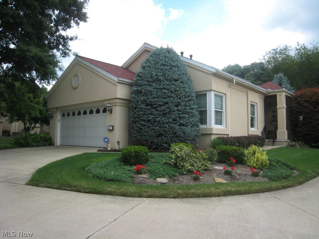 Wonderful detached stucco ranch condo. Two Bedrooms and two Full Bathrooms on main level, with 3rd Bedroom and Full Bathroom in basement level. Vaulted ceilings. Kitchen with granite counters and eating area. Separate dining area with door leading to enclosed porch. Living room with patio door to deck. First floor laundry. Den/study/office room directly off of entrance foyer. Beautifully finished Rec/Family Room with fireplace in basement. Ample storage in basement. Side entry 2 car garage. Beautifully landscaped. Security system. Includes home warranty. Total Living Area includes approximately 660 square feet of finished basement.