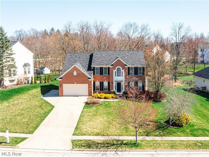 This immaculate colonial home features 4 bedrooms, 4 bathrooms and over 4,700 sq ft of finished living space!  Main level boasts a 2 story entryway,  private study, 9' ceilings, gourmet kitchen w/huge island, breakfast bar and convection oven, all adjacent to a morning rm w/vaulted ceiling and spacious family room with stone fireplace. A large dining room, living room, updated half bath and mudroom complete this incredible first level. Upstairs features a luxury owner's suite with 2 walk-in closets, lighted tray ceiling, free standing tub, double vanity and separate shower. 3 sizable guests rooms, updated guest bathroom and newly added laundry room finish out the second level. Lower level has been finished to include multiple entertaining areas including a family room, media/theatre room, additional living room and beverage station with bar! A third  full bathroom has been added to the lower level making this an excellent multi functional space! Notable improvements include flooring throughout the whole home, updated kitchen, remodeled bathrooms, 2nd floor laundry room, walk in closet with closet system, fresh paint throughout, all new hardware and lighting fixtures, garage hanging system (22), expanded driveway with additional parking, HWT (22), Washer and Dryer (22 &23), A/C (16) and nest thermostat!