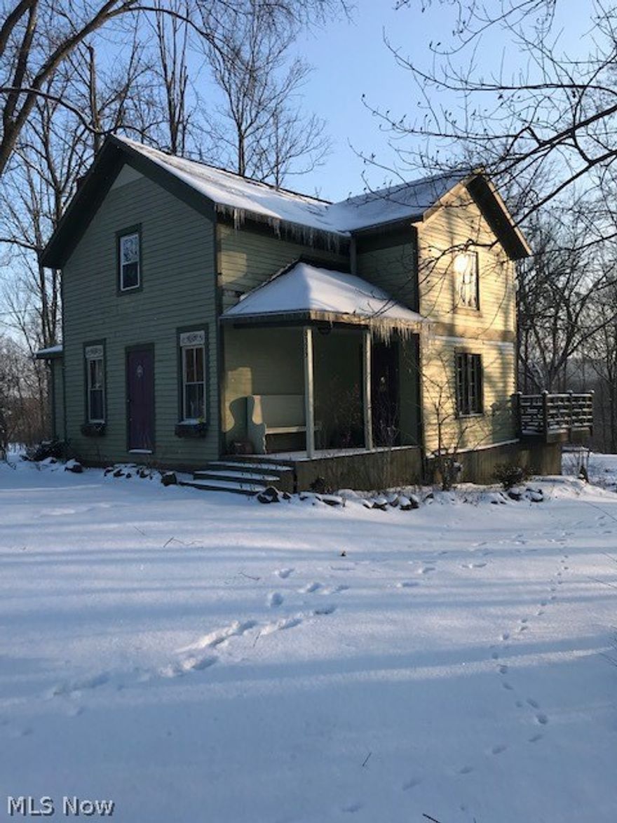 If you're looking for a cookie cutter home with no projects, then this probably isn't for you.  If, however, you have vision, and are willing to invest some money in updates, then this may be the equity builder you've been looking for!  We are offering a very unique opportunity to own an almost century home, walking distance to downtown Peninsula, the Towpath and the Cuyahoga Valley National Park!  With some updates, this gem could be fantastic, and sits on one of the best lots in Peninsula! 2.6 acres of woods and a ravine that leads down to the river!  Features include: First floor- a kitchen, modern full bathroom, plus dining and living rooms with gorgeous reclaimed barnwood flooring. There's also a spacious room on the side of the house that has been used as a master bedroom with plenty of lighting and wood flooring. That multi functional room could also serve as a play, family, or sun room!  Updates include well pump 2017, electric panel 2018, roof, furnace, septic and a/c all repl