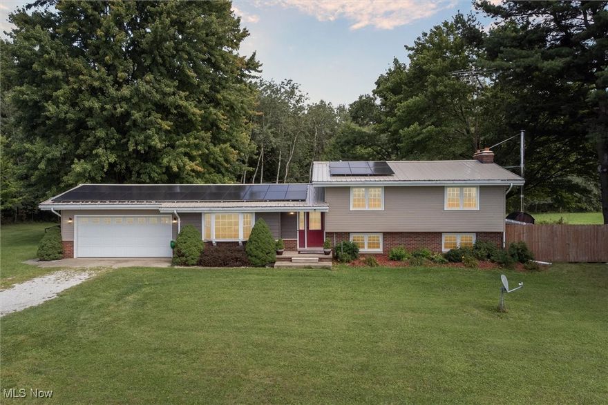 Nestled in a serene rural setting, this stunning Tri-level home offers an exceptional blend of comfort, modern amenities, and expansive outdoor space. Spanning over 4 acres, the property features a picturesque pond in the front yard, creating a tranquil atmosphere that enhances the natural beauty of the surroundings. The heart of the home you will see when walking in the front door. Beautifully designed sunken living room w/new brazilian cherry wood and hickory wood floors, open to the huge eat-in kitchen w/brand new modern facing cabinet doors, complemented by new backsplash, new countertops along w/ island. The upper level of this home boasts 3 well-sized bedrooms, 2 full baths, perfect for families or those seeking extra room for guests. Most rooms have brand new brazilian cherry or hickory wood flooring. The lower level features a huge recreation room, complete w/cozy fireplace that adds warmth, charm for all your family gatherings. An impressively large walk-in closet provides ample storage. Energy efficiency is a highlight of this home, w/solar panels installed just 2 years ago. Homeowners have enjoyed the benefit of no electricity bills since installed w/a 25 year warranty for peace of mind. Additionally, a new outside hypothermal furnace was installed in 2022 utilizing wood to keep the house warm during the winter months. The electrical systems were updated in conjunction w/the solar panels installation, enhancing the home's efficiency. Outdoor living is equally impressive, featuring 2 gazebos, a fire pit to enjoy. The new metal roof adds durability and style to the home. For those w/passion for vehicles/hobbies, the property includes an attached garage along w/ a detached  3 car steel garage, another detached 2 car garage featuring a full loft, offering ample space for storage or projects. Conveniently located just 3 mins from Rte 11 or just 6 mins to Jefferson.