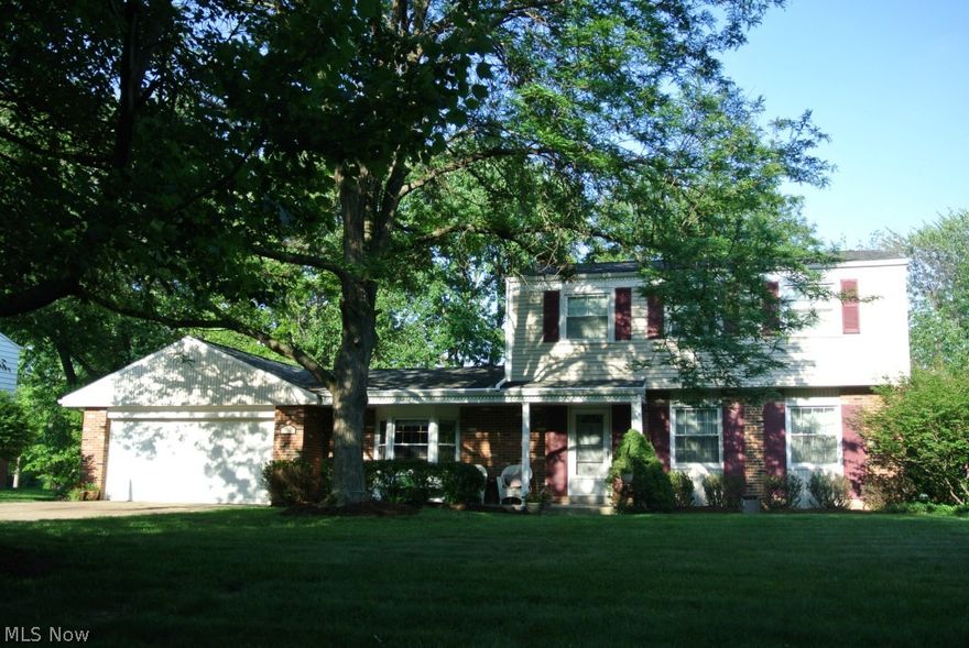 GREAT location for this nicely updated 3 Bedroom, 2.5 Bath Colonial with private yard & oversized patio. Updates include newer oak Kitchen, furnace & AC, roof, siding & gutters, most windows, baths, H2O tank, Family Room wood floor & beautiful stone Fireplace, & more! Hardwood floors in LR, DR, & Bedrooms. Oversized Family Room opens to large Sunroom. Rec Room features NatureStone floor & newer overhead lighting. School activities are right around the corner! Easy access to I-77. 1 year Home Warranty included!