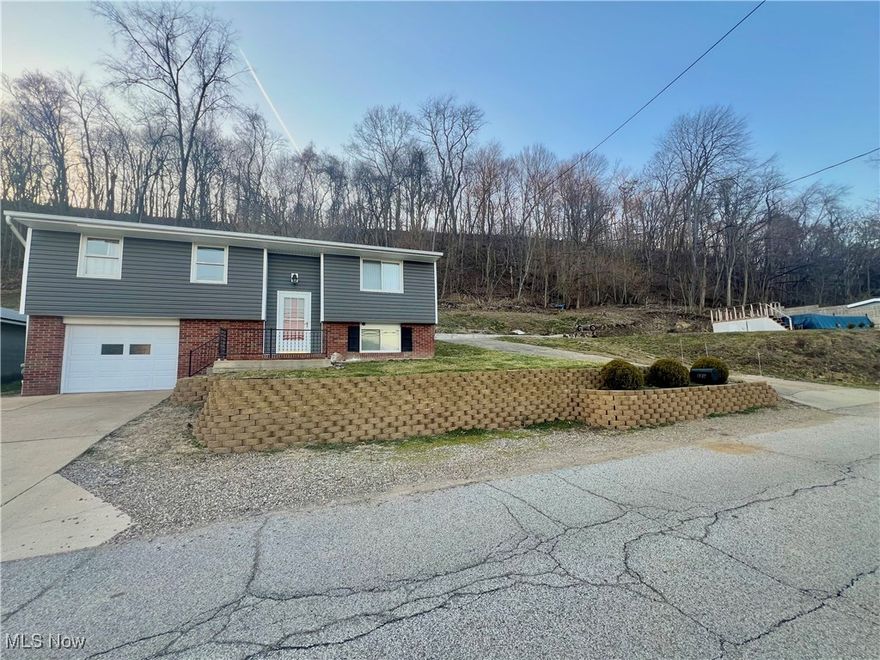 Welcome to this charming split-level home nestled on a spacious .46-acre lot! This well-maintained 4-bedroom, 1.5-bath home offers a perfect blend of comfort, convenience, and outdoor enjoyment. As you enter, you'll be greeted by an inviting living space with plenty of natural light, making the home feel bright and airy. The main level features an eat-in kitchen with ample cabinet space, perfect for meal preparation and family gatherings. The open living room features beautiful hardwood floors and a large window. On the main floor you'll also find three bedrooms, providing plenty of room for the whole family. The full bath is recently updated featuring a bathfitters tub/shower. The lower level features the laundry room, a half bath for convenience, an additional bedroom, and a nice sized bonus room that would make a great additional bedroom, office, playroom, etc. 
The expansive backyard features a partially fenced-in yard, perfect for pets or children to play safely. Relax and unwind in the above-ground pool with deck, ideal for hot summer days. Plus, the attached garage provides easy access and additional storage space. Not to mention lots of off-street parking. This property offers plenty of space to spread out and enjoy the outdoors while still being close to all the amenities you need. Don’t miss the opportunity to make this wonderful house your new home!