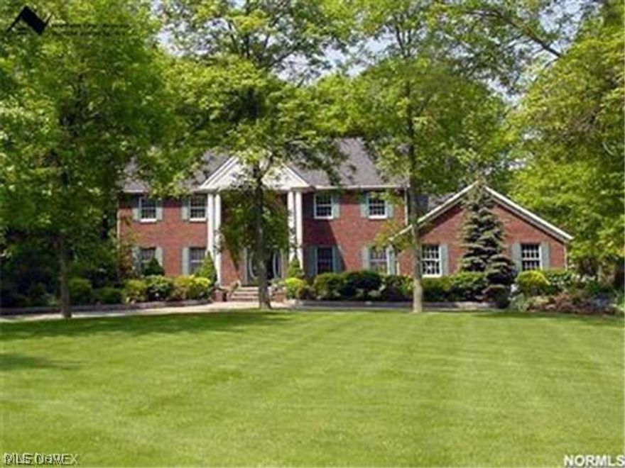 ELEGANT & IMPRESSIVE custom brick colonial w/deep set back (Circular Drive/3 car HEATED garage) on private (Park like lot) 1+ acre lot, FINISHED BASEMENT, 4 fireplaces, grand foyer, 4 exits to large deck!  A must see home that will greet you with strong pillars and full brick construction/side load garage easily viewed from the circular drive. Enter to newer wood flrs & soaring ceilings that show off the curved custom staircase, spindled loft area...French doors leading to 1ST FLR DEN. Volume ceilings throughout w/ 5600+ finished space that is bright & cheery with oversized curved windows. Detail is unbelievable w/premium electrical, zoned HVAC (1 new unit), dramatic fireplaces, lighting, crown molding. Gourmet kitchen w/GRANITE tops, center island & decor appliances (36" range)...opens to oversized formal dining. Vaulted owner's suite w/sitting area, pillars, fireplace, skylights, Glamour marble bath/tiled shower! ENTERTAINER DREAM w/ one of a kind family rm w/wet bar...additional wet