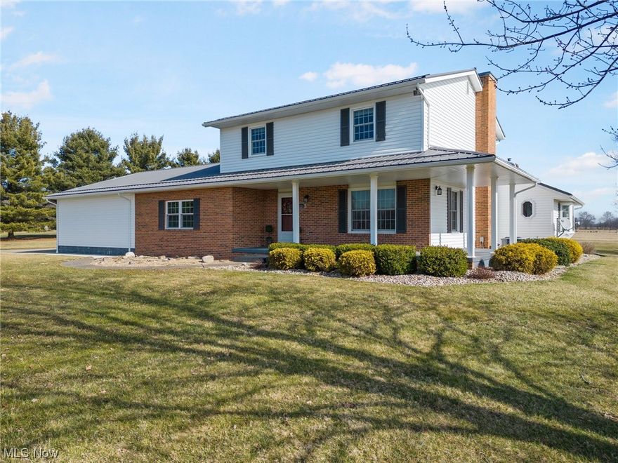 Splendid and Spacious home situated on 5.5 level acres, in an area of beautiful homes, offers immediate possession to the new owner! You will be impressed with all the updates and meticulous care this home has to offer. A 2019 addition offers complete one level living! 4 to 5 bedrooms and 4 bathrooms total. A master suite on the first and second level! All new "smart" appliances including washer and dryer in 2022 stay! Other numerous updates include: addition, insulation, & roof in 2019, siding & windows 2020, hot water heater 2020, sump pump 2018, heat pump with propane back-up & air conditioner 2018, all new gorgeous kitchen with solid surface counter tops and ample cupboard space plus pantry in 2022, whole house Generac generator 2018. Gorgeous great room with vaulted wood ceiling, bay window, stone wall with beautiful mantle and a pellet stove. Large formal dining room could also be a great home office! First floor laundry with laundry sink and half bath. Upstairs you'll find 3 bedrooms with new carpet in 2021 and 2 full bathrooms. You'll find a rec room/exercise room complete with a sauna in the lower level. Full basement under the original house with a cement floor crawl space under new addition. Outside you'll enjoy the spectacular 48x56 detached garage with work shop, office, & half bath. Large barn and 2.5 acres of pasture if you'd like to have animals! Det. garage and barn have some new doors. Spectrum internet! Carroll Electric Co-Op $230 month, Propane tank is leased and is used for heat pump back-up and generator only. Previous owner retained mineral rights. Surface rights will transfer. Only 30 to 40 minutes from Canton, Alliance, and New Philadelphia.