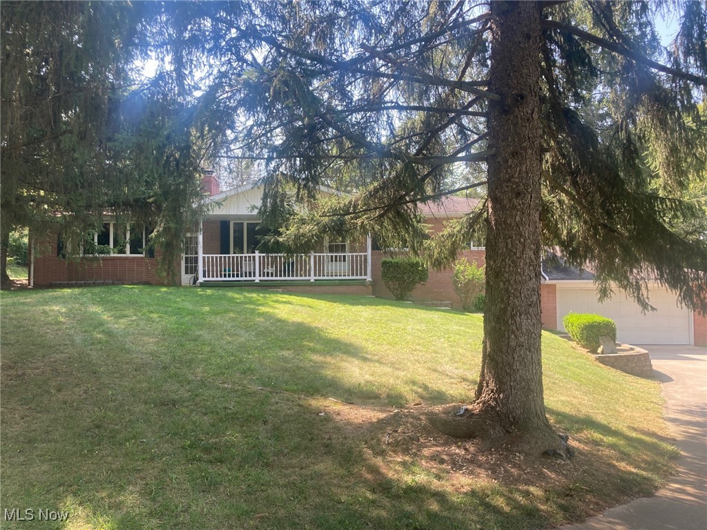 Beautiful country setting on one acre in Tuslaw Schools! Nice three bedroom brick ranch home with good curb appeal, having a nice front porch and attached two car garage Coming in your front door you have the living room with a large front window for good lighting, and a woodburning fireplace. The dinette area also has a large window/great for watching the back yard wildlife! The kitchen comes with appliances and pantry! You will LOVE the SPACE in the first floor family room! This room has another fireplace, a dry bar (perfect for get togethers), and doors to your patio. There are three bedrooms on the main floor. The master bedroom does have an attached half bath! In the basement area you have an oversized rec room with another dry bar, and an additional finished room that could be an extra bedroom or home office. The basement does have a door to the attached two car garage for easy access. If you have been waiting for a home in the country - this home is for you!