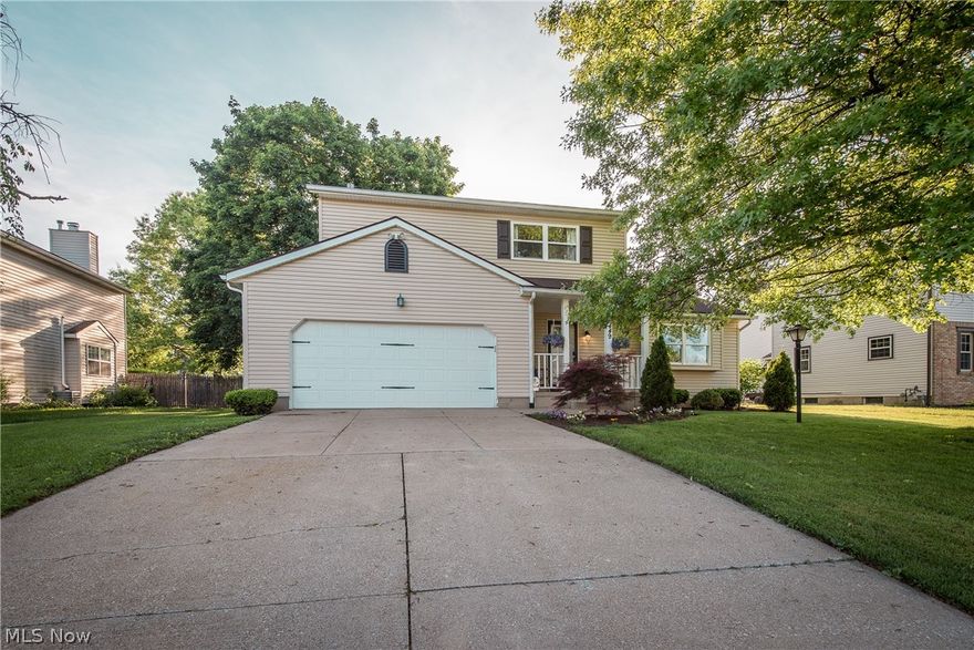 You don't want to miss this stylish Colonial in the Plain Local School District!  Nicely updated with bamboo flooring that flows throughout the main level, including the kitchen with hardwood cabinetry, solid surface counters, mosaic tile backsplash and stainless steel appliances.  The dining area can accommodate a large table and looks out to the treed backyard.  The living room offers a modern rustic feel with a beamed vaulted ceiling and wood burning fireplace with floor to ceiling brick surround.  A sliding barn style door conceals the laundry room complete with pantry closet, front loading washer and dryer, ceramic tile floor plus a door to the backyard.  An updated guest bath completes the main level.  Upstairs you'll find 3 generously sized bedrooms, including the master with wood flooring and private access to the full bath complete with newer vanity with undermount sink. tub/shower combo with tile surround and wood look tile floor.  The other bedrooms have new carpet and acces