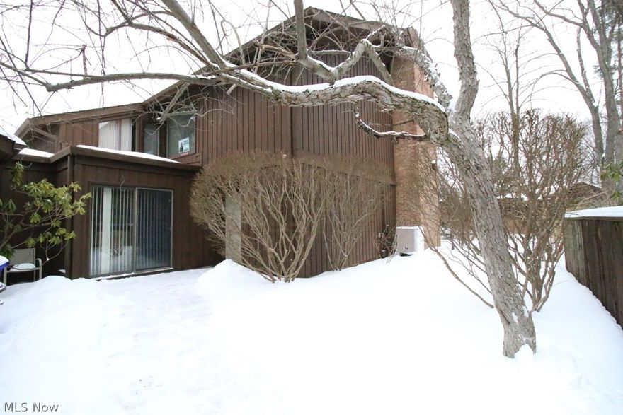 Beautiful condo nestled amidst nature at its best! Open and spacious floorplan. This 2-story condo is located in The Pines in Twin Lakes. The oversized formal living room boasts a woodburning fireplace and newer carpeting. The formal dining room with newer carpeting opens to both the kitchen and formal living room. A wall of patio doors offers a great view of the patio surrounded by nature. The kitchen has white cabinetry with brushed nickel hardware, newer stainless dishwasher, beautiful tile backsplash, granite countertops and luxury plank flooring. The kitchen opens to a family room with a view of the front patio and entrance. The foyer has double entry doors adding to the grandy entry way, luxury plank flooring and a 2-story turned staircase leading to the second floor. There is a first-floor laundry room for added convenience and a half bath. The second floor has 3 bedroom all with vaulted ceilings, 2 with newer carpeting. The master bedroom boasts a woodburning fireplace, doors l