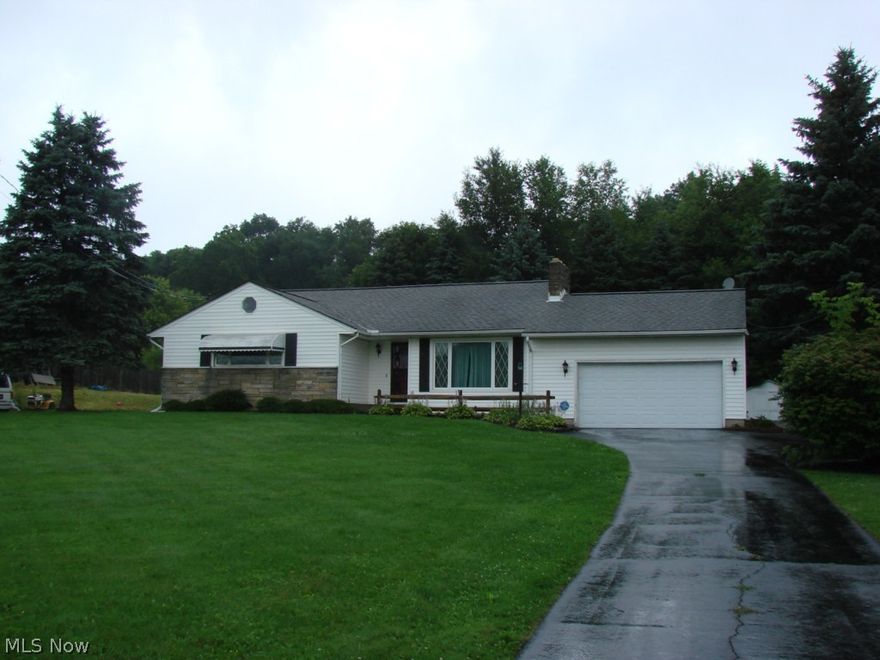 REDUCED! REDUCED! REDUCED! Charming one story ranch with walk up attic that has plenty of space for lots of storage, sunken living room with woodburning fireplace, formal dining room,  three season sun porch, kitchen with all the appliances, large master bedroom with half bath, large main bath. Bedrooms all have cedar closets, one bedroom has built-in desk. Windows are "Weather Tight" brand with wood color interior. Basement has semi finished rooms which include a craft room or office, rec room with a bar & electric fireplace, walk out basement, city sewer. Great size laundry room in the basement.  HUGE REDUCTION!