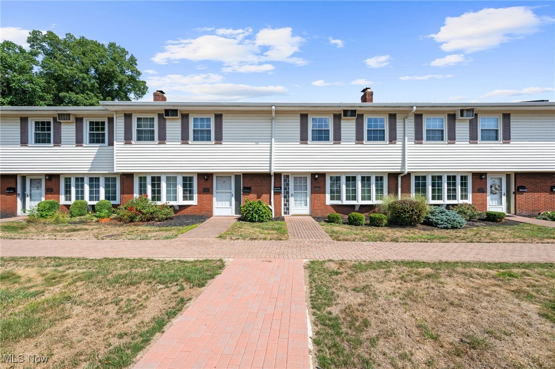 Follow a charming brick walkway to the entrance of this spacious and well-maintained townhome located in the desirable Meadowlawn Community. Step inside to the welcoming foyer featuring a beautiful curved staircase and a large living room with newer windows, custom built-ins, brand new carpet and a gracious woodburning fireplace - perfect for relaxing or entertaining. The open layout continues into a nicely sized tiled dining area and an updated kitchen complete with all appliances. Just off the kitchen is a cozy den that opens to a private patio, offering a great space for outdoor enjoyment. The attached two car garage is conveniently accessible from the den, and a main floor half bath and laundry room add to the home's functionality. Upstairs, you'll find three generous bedrooms, including a spacious primary suite with a large closet and a renovated en suite bath featuring a stylish tiled shower. The two additional bedrooms share an updated full bath, making this layout ideal. With ample living space, modern updates and a location in an amenity-rich community - opportunities like this don't come around often. Schedule your showing today and make this wonderful home yours!