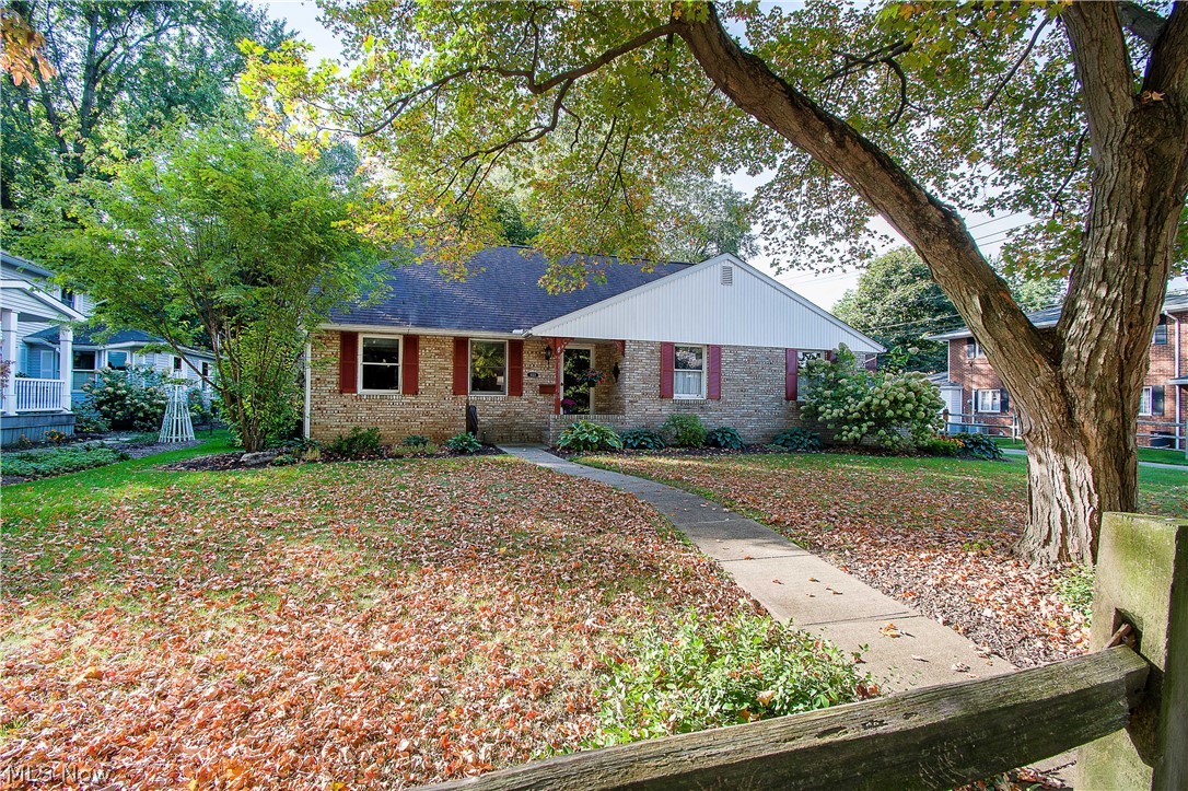 This lovely and unique Bungalow offers lots of character and charm! You will love the cathedral ceiling with exposed beams and a wood-burning fireplace as you enter the great room. The inviting eat-in kitchen offers appliances, plenty of cabinets, a pantry, and a breakfast nook/dinette area with a bayed window overlooking the backyard. Adjacent to the kitchen is a half bath and an office or multi-purpose room with a built-in counter/cabinets and garage access. The formal dining room is spacious with convenient access to the covered back porch and private fenced-in yard. The master bedroom with skylights and a master bath is upstairs, and the 2nd bedroom/loft area has built-in shelves and two skylights. Downstairs the partially finished basement features a large rec room, perfect for entertaining family & friends, the laundry area has a full bath (with a walk-in shower), and there is plenty of storage space. Two car attached garage. Some update includes new laminate flooring in the grea