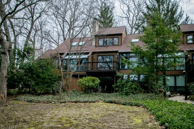 Welcome to the premier Meyers Lakefront Community of Moonlight Bay Condos. This spacious 2 bd, 2.5 ba condominium boasts 2 living and entertaining spaces, both with impressive floor to ceiling brick fireplaces and large windows. Natural light abounds through skylights and western facing windows that offer serene views of Meyers Lake. Three private outdoor entertaining spaces and a garden provide ample space to enjoy the upcoming spring and summer weather. Neutral tone ceramic floor, custom back splash tiles and recessed lighting add to the charm of the open eat in kitchen. Relax in the jetted tub of your master suite with views through the loft skylight. Attached, extra-large, one car garage, spacious laundry room and expansive closets add to the ample storage of this home. Invite friends for tennis at your luxury court or rent the lakeside clubhouse for gatherings. Seasonal boat dock spaces may also be rented, enabling you to impress all your guests with the beauty and leisure of Meye