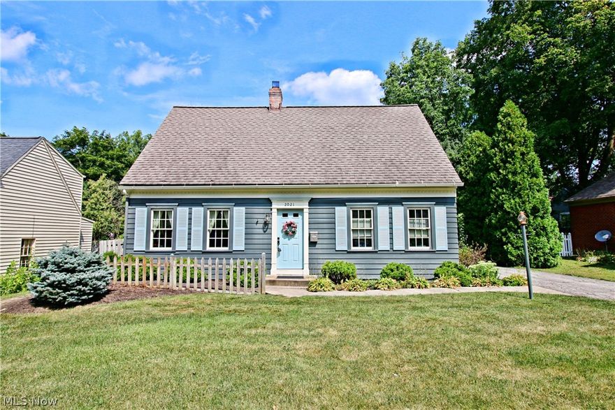 This Western Reserve Cape Cod offers a lot of character and charm in the heart of W. Akron. Gorgeous newly redone hardwood plank flooring through out.  Living room with built-in bookcases is currently used as a den. Formal dining and spacious family room boast wood burning fireplace and opens to the back yard screened-in porch. Many improvements include roof 2003, newer windows and updated kitchen and baths. Space saving kitchen includes all appliances.  Waterproofed partially finished basement has recreation room and laundry area washer, dryer and freezer will stay..also has basement shower and glass block windows. 1 car detached garage and fenced yard. One year home warranty offered by seller.