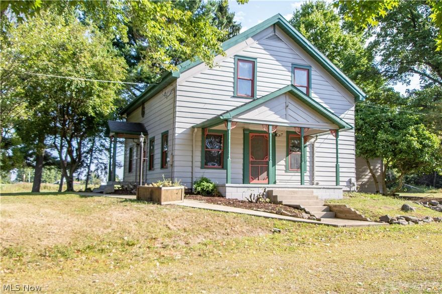 Updated country estate is move in ready! This century home features a covered side porch that leads in to a large living room which opens to a dining room and updated kitchen. First floor bedroom (could be used as a den or home office) and full bathroom. The 2nd floor has a 2nd full bathroom 2-3 additional bedrooms including an open loft space. New paint and carpet throughout. Full basement has a walk-out storm door. New hot water tank. There's an additional unfinished storage room attached to the rear of the house- could be used as a first floor laundry/ utility room, storage space, or could be converted in to an additional room or home office. 2 car detached garage. 4 acre corner lot, partially wooded. This home comes complete with a home warranty. Call today for your private showing!