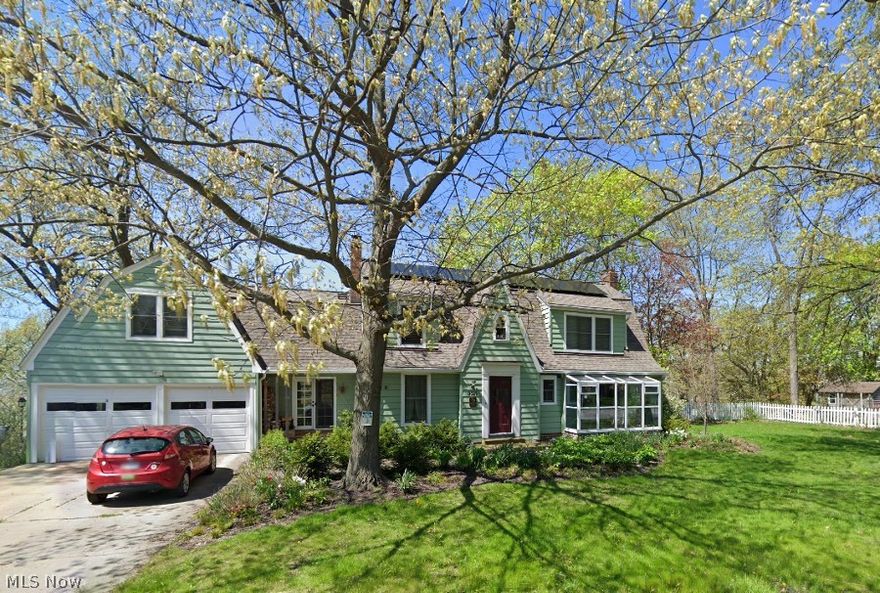 Take a front seat on Lake Erie in this charming, fully remodeled 1928 Dutch Colonial home. You will have the use of 1,200 ft. of private beach adjacent to Headlands State Park. The Mentor Marsh Nature Preserve is across the street. From your backyard, walk out to swim, launch your boats, or roam a whole mile of the finest sand beach in Ohio. Extra wide 200 ft. street frontage affords privacy with the option of building a second home. The guest house at the foot of the hill is fully equipped with kitchen, bath and heating. It sleeps up to 5 and can also serve as a studio. From the main house and porch enjoy idyllic views of the park-like lakefront with magnificent sunsets and abundant wildlife. An open floor plan connects the dining, kitchen and living area. The 1st floor also has a cozy, octagonal TV room and an office with a solarium where you can keep plants year round. Upstairs, the large master bedroom has its own bath and walk-in closet. A separate suite has 2 bedrooms and bath on