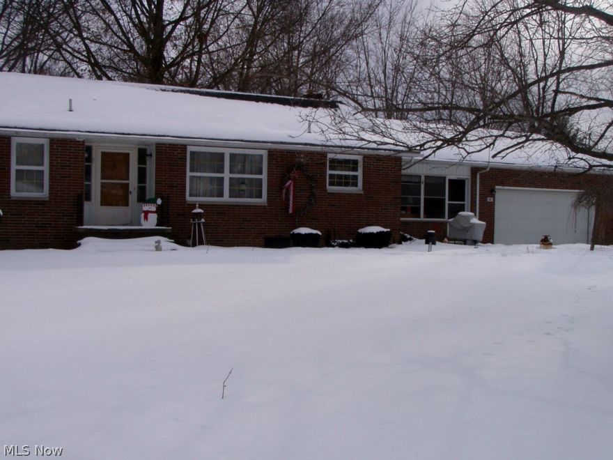 Located on dead-end street. Sprawling brick ranch features hard wood floors, wood burning fireplace, sunroom and 2-car attached garage.