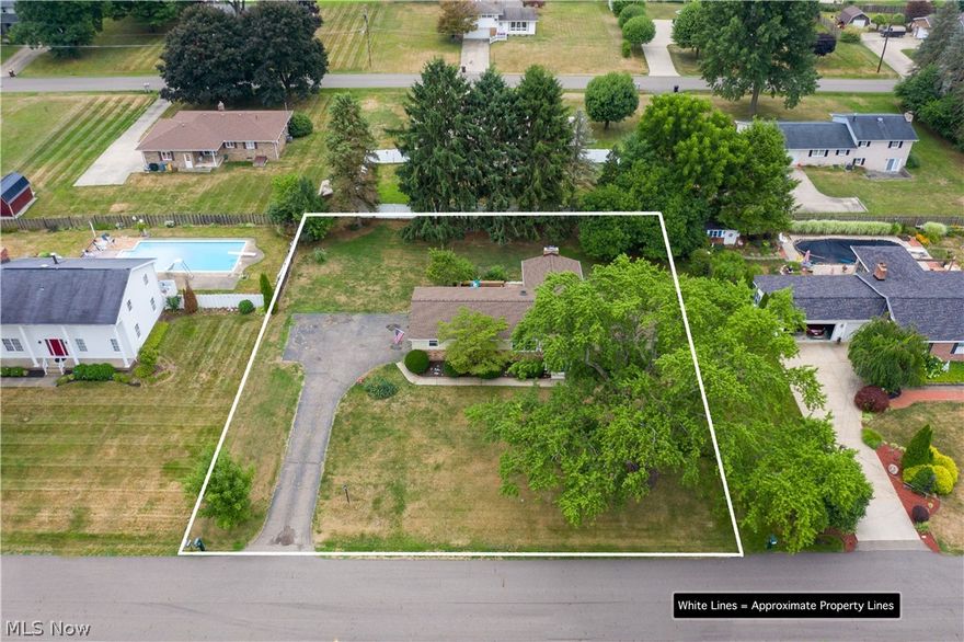 3876 N Vista St NW, Uniontown, OH 44685 in Lake Township with Lake Local Schools is one floor living in a beautiful setting with great size yard & gorgeous rear deck and large basement 3 bedroom, 1 bath, 2 car garage with family room addition and fireplace. Plenty of updates throughout including Roof 2018, Windows 2018, Electric Panel 2018, Sump Pump 2018, Utility Sink & Plumbing with Washer Plumbing; Family Room Addition has a gorgeous wood burning fireplace to keep cozy during the winter; wonderful deck off the rear Family Room for grilling and entertaining or sip on a glass of wine while listening to the birds! Beautiful kitchen designed in maple with Island and Separate Dining Area. Close proximity to Quail Hollow and easy to get to the highways to travel to the airport or the many area stores! The unfinished but bright useable basement has a bank of cabinets great for storage and decorating. Call your favorite real estate professional today to reserve your private showing appointm