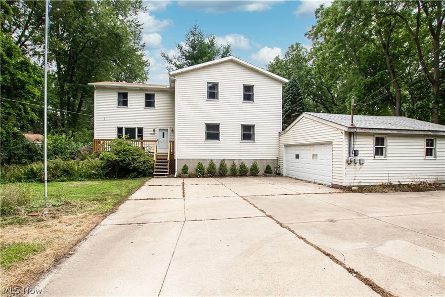 Welcome to 35684 Lakeshore Boulevard! This Eastlake colonial boasts over a half-acre lot just moments from I-90 and Route 2, nearby opportunities for fishing, boating, dining, and more! Step inside to a spacious living room, and pass by a wall of windows to discover a large kitchen with a pantry and ample counter space. A family room offers access to the backyard, while a den with hardwood floors leads to utility space and a half bath to complete the main level. Upstairs, discover a primary suite with tons of storage, a sitting room perfect for a home office, and a dedicated ensuite bathroom. Two additional bedrooms share a full bathroom and a second-floor laundry room adds convenience. Outside, you'll love hosting family and friends on the two-tier deck overlooking the yard with mature landscaping. There is a 50 amp hookup in the garage for your boat, RV, or electric vehicle, no electrical work is needed!