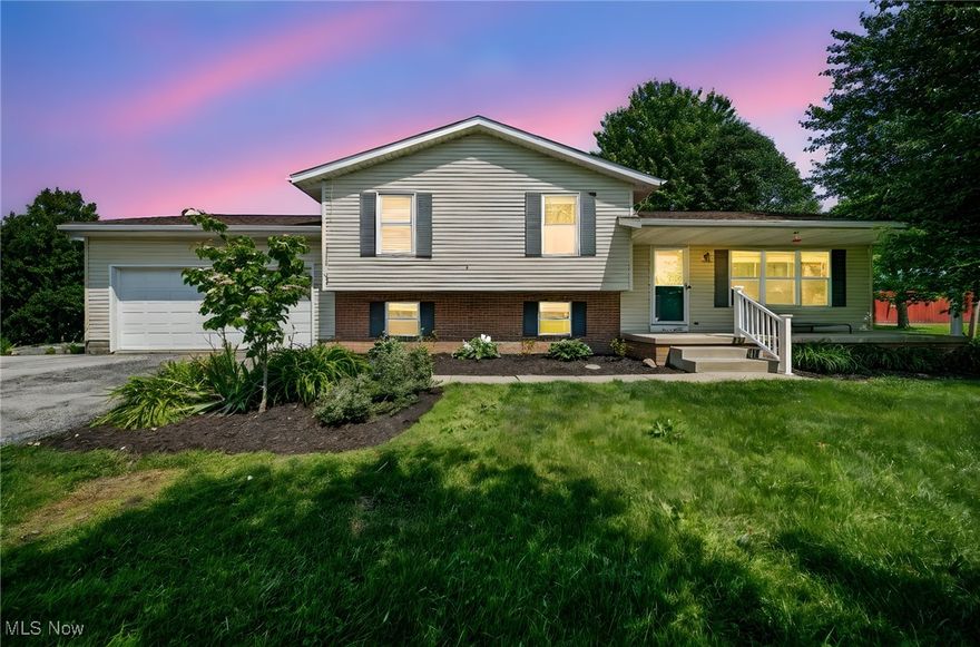 Enjoy a semi-rural setting close to local parks, while still accessible to city amenities in Aurora and nearby Mantua. Introducing this spacious split-level single family home, built in 1997, nestled on a 3.01 acre property with wooded views, making it feel like a peaceful retreat while being close to town.  350 Townline Rd is a spacious, well-maintained 4 level-split home offering a blend of comfort, functionality, and privacy on a picturesque 3-acre lot.   Amazing  parking capabilities, cozy living spaces, and proximity to schools and amenities.  More features include a welcoming front porch, rear patio, and outbuildings suited for recreation, pets, and hobbies.   Convenient storage and parking: large garage, RV pad, and a huge 30x40 Outbuilding  with 3 doors and a concrete floor.  Spacious 3 car attached garage with electric opener.   Warm and inviting interiors featuring a fireplace in the family room and oak cabinets in the kitchen.  Approximately 2,488 square feet of living space, with 3 bedrooms and 2.5 baths.