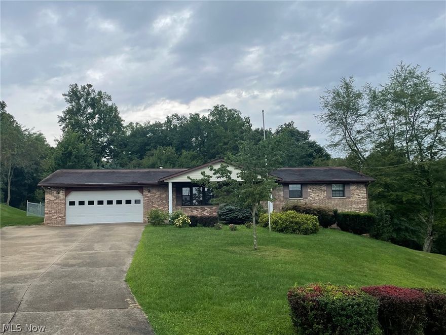 Fantastic brick ranch, all one floor living home. Sitting on 3 lots totally 1.5+/- acres with a private back yard setting, just minutes from town, and offers all public utilities. Home offers a spacious living room with decorative fireplace, eat-in kitchen with bar; French doors to back patio overlooking your fenced in back yard with basketball court area. In addition, fist floor offers 3 bedrooms, laundry on first floor with full bath combined and an additional full bath. Lower level offers family room with stone wall gas log fireplace and sliding doors; full bath, utility room with abundance of storage; and interior steps to garage. If you don't want this much acreage, side lots could be sold off for building sites.