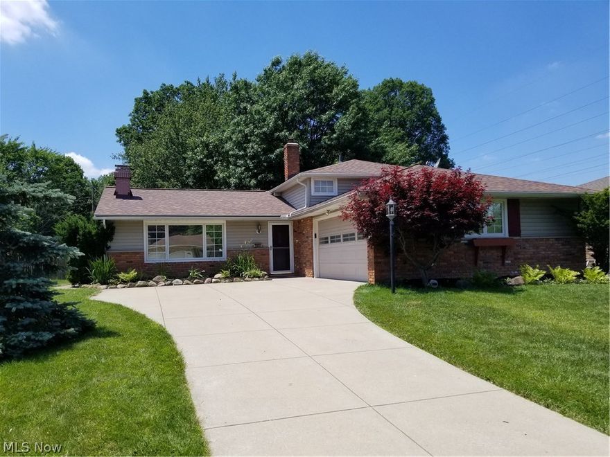 Welcome Home to this spacious split level with a private park like yard. Brand new tear off roof June 2018 with warranty transferable. Brand new carpeting  June 2018 in Living room, dining room and family room. The front foyer, step down living room with a wood burning fireplace, formal dining room are warm and inviting. Large eat in kitchen has views to family room as well. Off of the dining room is a large enclosed sun room with vaulted ceilings - a wonderful place to entertain.  Second floor has three bedrooms with a full bath. Lower level has a large family room, and half bath for guests. Make your personal tour of this lovely home today!