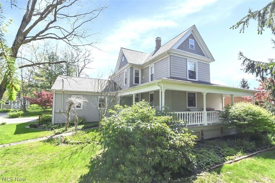 Step into the charm of a classic century farmhouse beautifully blended with thoughtful modern updates. This spacious five-bedroom, two full bath home offers timeless character alongside today’s conveniences, featuring a newer roof, newer appliances, and a freshly painted deck ready for outdoor enjoyment. Inside, the main level showcases stunning refinished original hardwood floors that bring warmth and history to every room. The elegant formal dining room is perfect for hosting, complete with built-ins and plenty of space for gatherings. A cozy sitting room filled with natural light from newer windows offers a peaceful retreat, while the inviting family room includes a dedicated office space—ideal for working from home or managing daily life. The eat-in kitchen is both functional and stylish, featuring quartz countertops and ample room for casual dining. Step outside to enjoy the wraparound porch, perfect for morning coffee or unwinding in the evening. Out back, you’ll find a large two-tier deck designed for entertaining, overlooking a serene green space. The backyard is a true highlight, offering a fire pit area, swing set, shed, and plenty of room for outdoor activities. Upstairs, five generously sized bedrooms provide comfort and flexibility, all filled with natural light. Completing the home is an oversized attached 2.5-car garage, offering plenty of storage and convenience. This property is a rare blend of historic charm, modern updates, and inviting indoor-outdoor living—ready to welcome you home.