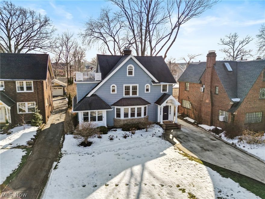 Welcome to this beautifully updated Lakewood Colonial, where 1920s charm meets modern comfort and convenience. A newer custom front door opens into a welcoming foyer and leads you into the light-filled formal living room, complete with a working fireplace, built-ins, custom window treatments, crown molding, and refinished hardwood floors.  A versatile first-floor workspace-surrounded by six newer windows—connects seamlessly to the inviting three-season porch, creating the perfect spot for morning coffee or quiet afternoons. The formal dining room flows into the fully remodeled kitchen featuring quartz countertops, custom cabinetry, stainless steel appliances, and a rare walk-in pantry. A thoughtfully designed mudroom addition with heated ceramic floors adds everyday practicality, and a renovated powder room completes the main level.  Upstairs, the owner’s suite impresses with a new custom walk-in closet and a fully renovated bath showcasing an aromatherapy steam shower. The hall bath has also been tastefully updated. The third floor offers two additional bedrooms, a full bath, and a charming balcony with lake views—an ideal guest retreat or teen suite.  The remodeled walkout basement expands your living space with a wet bar, Everstone Flooring, beamed ceilings, glass block windows, abundant storage, and waterproofing for peace of mind.  Additional updates and improvements include newer driveway and stamped patio, newer AC, boiler, and water tank, updated electrical panel and lighting, exterior repainting, newer carpet, fixtures, landscaping, and windows throughout.  All of this is set in a highly desirable Lakewood location close to parks, schools, restaurants, and everything this vibrant community has to offer.  Make your appointment today!!