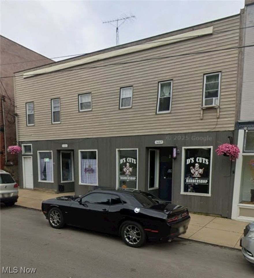 Don’t miss this turnkey investment opportunity! Well-maintained 4,520 sq ft mixed-use commercial building situated on 0.13 acres. The property features two commercial storefronts on the lower level, currently leased by a bakery and a barber shop, and four apartments on the upper level, including two 2-bedroom units and two 1-bedroom units. Each apartment comes equipped with a refrigerator and electric stove, and tenants are responsible for their own electric.

The building has undergone numerous updates in recent years, including a new furnace and AC unit in the commercial spaces in 2022, and upgraded furnaces for the apartments, all serviced annually and under 10 years old. The large hot water tanks were replaced in 2022, and the apartments received updates between 2020 and 2023, including new paint, flooring, and appliances. The roof was replaced in 2010, and additional exterior improvements include new gutters and a rebuilt deck in 2020, as well as new exterior windows and doors in 2021, with several window replacements between 2020 and 2022.