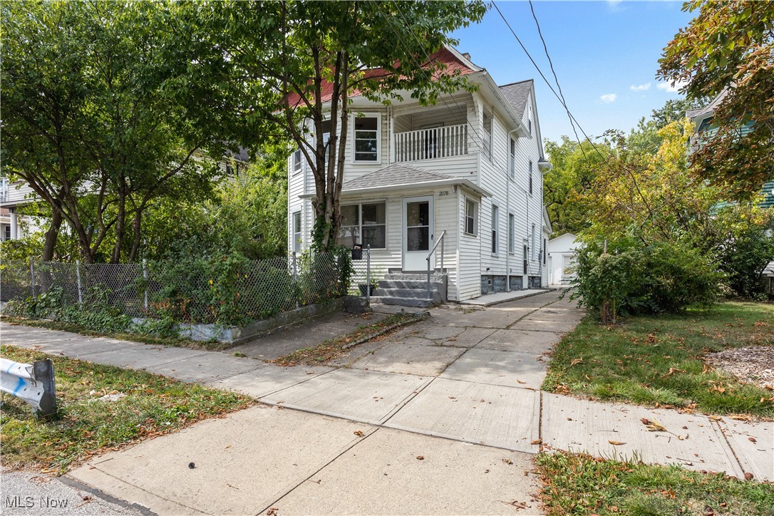 Large, move-in ready home beautifully remodeled from top to bottom! Fresh paint and beautifully restored original hardwood flooring throughout this 4-5 bedroom, 2-full bath home that has easy freeway access and is close to Lakewood shops and restaurants, Edgewater Park and Gordon Square. Home perfectly combines modern decorating touches with the historic charm of 5-panel solid wood doors with antique knobs and hardware, a large glass block window on the main floor landing and glass block windows in the basement. Kitchen has been completely remodeled with new flooring, tile backsplash, cabinets, exposed brick and large island with butcherblock countertop that can accommodate 2-3 barstools. Comes with gas stove and refrigerator. There is also a full bath off the kitchen and a large room that can be used as a pantry and/or additional storage space. New roof on house and garage installed in 2020. Newer windows throughout, including 4 new energy efficient windows with lifetime warranty in the front bedroom. Large detached tandem garage can hold 2-3 cars plus additional storage. Second floor contains 3 large bedrooms (one with attached balcony) with beautifully restored original hardwood floors and 1 full bath. Third floor contains large bedroom and another room that can be used as either a bedroom or has the plumbing to be turned into a large glamour bath. Basement is clean and freshly painted, contains washer/dryer and has glass block windows. Don’t miss your chance to make this exceptional property your new home! CINCH Home Warranty is in place.