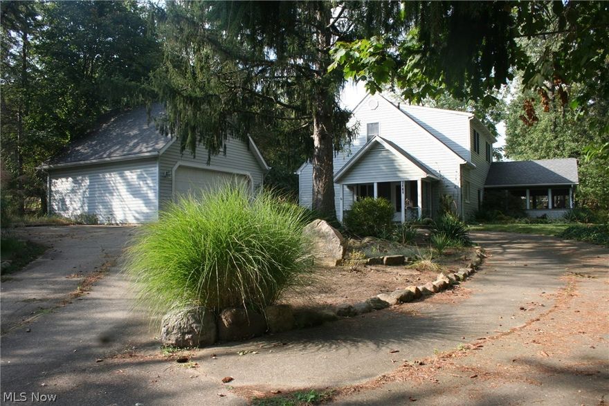 Hidden gem in Ellet with privacy in a park like setting. Large circle drive leads to a 24x23 garage with a 12x23 loft above and a 100 amp breaker panel, with a 9x23 covered porch. The house boasts an updated kitchen with gas range, refrigerator,built in dishwasher and a microwave. This kitchen has plenty of cabinet space and a breakfast bar that seats 5/6 bar-stools. Off the kitchen is a completely renovated full bath with ceramic tiled walls and floor. First floor also boasts large laundry room with a washer & dryer with tons of storage space with it's own entrance door that leads to the detached garage and large private backyard. Also located on the main floor is a large dining room, living room and huge master bedroom/family room all finished with beautiful oak trim. At the top of the stairway you will find a large open loft with a built in bookcase and two access doors to more storage space. Off of the loft there is a completely remodeled full bath with a double bowl vanity, cerami